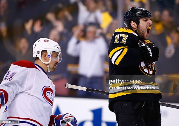 Milan Lucic of the Boston Bruins celebrates his empty-net goal in the third period against the Montreal Canadiens in Game Two of the Second Round of...