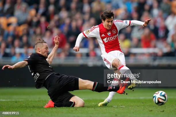 Bojan Krkic of Ajax gets past Rens Van Eijden of NEC to shoot and score his teams second goal during the Eredivisie match between Ajax Amsterdam and...