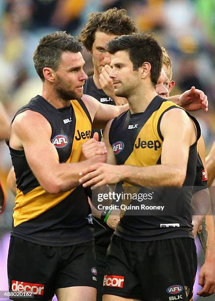 Chris Newman of the Tigers is hugged by Trent Cotchin after playing his last game during the First AFL Elimination Final match between the Richmond...