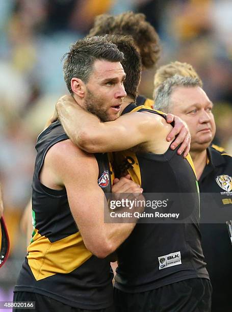 Chris Newman of the Tigers is hugged by Trent Cotchin after playing his last game during the First AFL Elimination Final match between the Richmond...