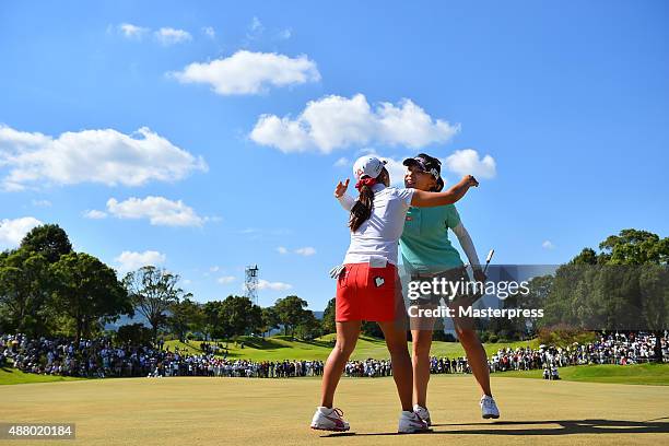 Teresa Lu of Taiwan hugs Bo-Mee Lee of South Korea after winning putt on the 18th green during the final round of the 48th LPGA Championship Konica...