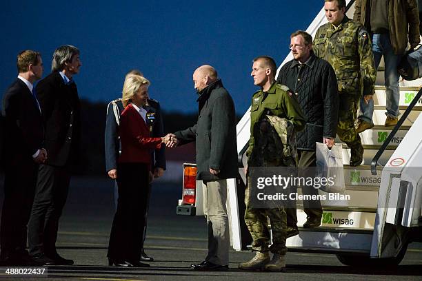 German Defense Minister Ursula von der Leyen greets the freed OSCE observer, Axel Schneider, and the other mission workers following their release...