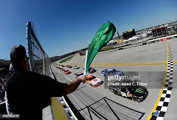 Sam Hornish Jr., driver of the Monster Energy Toyota, leads the field at the start of the NASCAR Nationwide Series Aaron's 312 at Talladega...