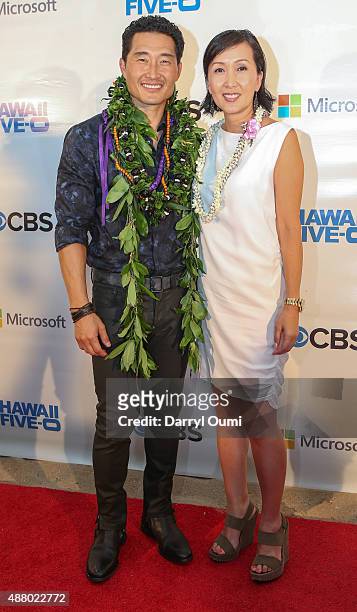 Daniel Dae Kim and his wife Laura Kim arrive at the CBS 'Hawaii Five-0' Sunset On The Beach Season 6 Premire Event at Queen's Surf Beach on September...