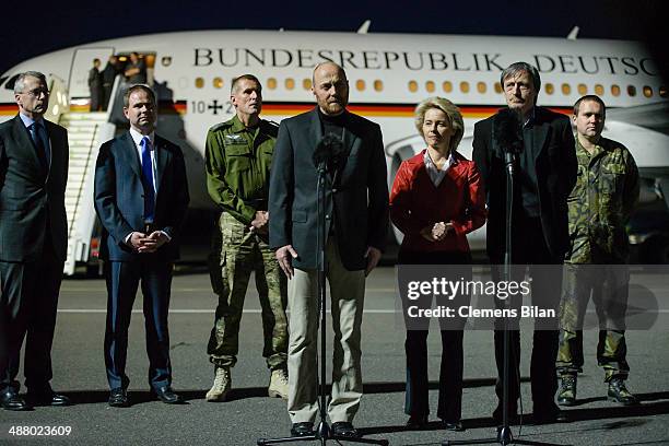 Freed OSCE observer, Axel Schneider , speaks during a press conference, next to Danish Defense Minister Nicolai Wammen , German Defence Minister...