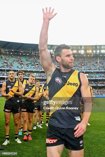 Chris Newman of the Tigers waves good bye to the crowd after playing his last game during the First AFL Elimination Final match between the Richmond...