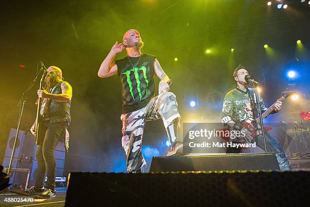 Chris Kael, Ivan Moody and Jason Hook of Five Finger Death Punch perform at Xfinity Arena on September 12, 2015 in Everett, Washington.