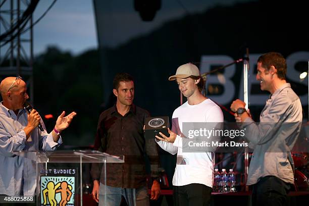 Richard Fries, professional cyclist Christian Vande Velde, actor Patrick Schwarzenegger and professional cyclist George Hincapie speak onstage at the...