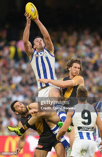 Todd Goldstein of the Kangaroos marks over the top of Troy Chaplin and Tyrone Vickery of the Tigers during the First AFL Elimination Final match...