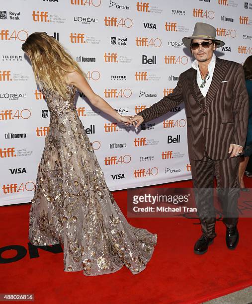 Amber Heard and Johnny Depp arrive at "The Danish Girl" premiere during the 2015 Toronto International Film Festival held at Princess of Wales...