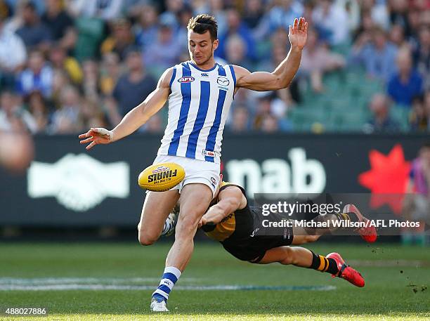 Robbie Tarrant of the Kangaroos and Brandon Ellis of the Tigers in action during the 2015 AFL First Elimination Final match between the Richmond...