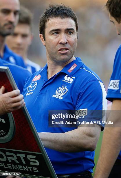 Brad Scott, Senior Coach of the Kangaroos makes changes during the 2015 AFL First Elimination Final match between the Richmond Tigers and the North...