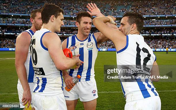 Michael Firrito of the Kangaroos shakes hands with Lindsay Thomas after the 2015 AFL First Elimination Final match between the Richmond Tigers and...