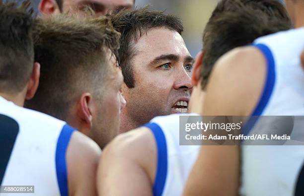 Brad Scott, Senior Coach of the Kangaroos addresses his players during the 2015 AFL First Elimination Final match between the Richmond Tigers and the...