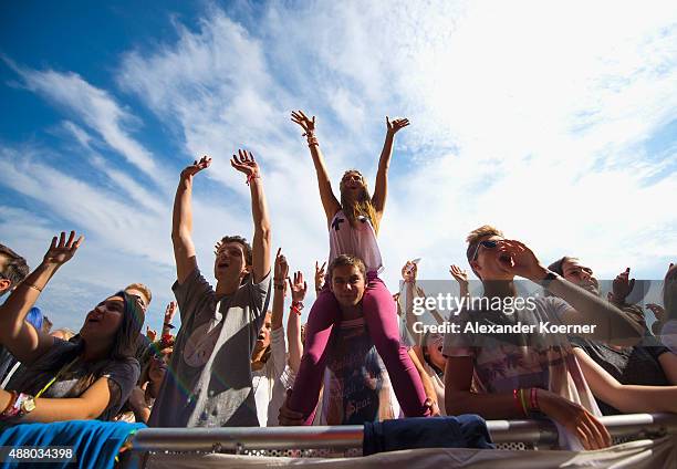 Fans cheer for DJ Felix Jaehn during the second day of the Lollapalooza Berlin music festival at Tempelhof Airport on September 13, 2015 in Berlin,...