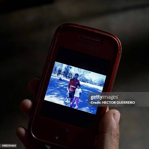 Blanca Alejandra Gonzalez, wife of Jose Angel Campos Cantor, one of the 43 missing students, shows the last photograph she took with her mobile of...