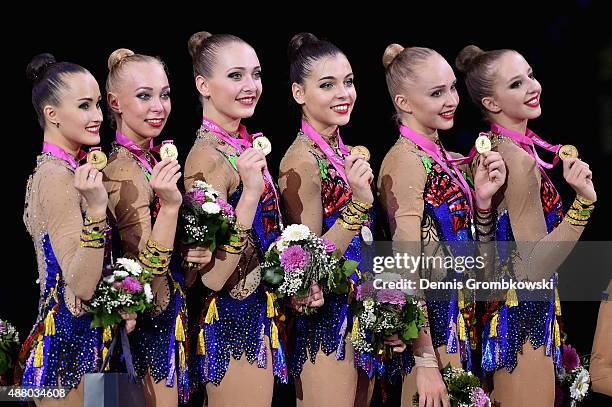 Diana Borisova, Daria Kleshcheva, Anastasiia Maksimova, Sofya Skomorokh, Anastasiia Tatareva and Maria Tolkacheva of Russia celebrate at the podium...