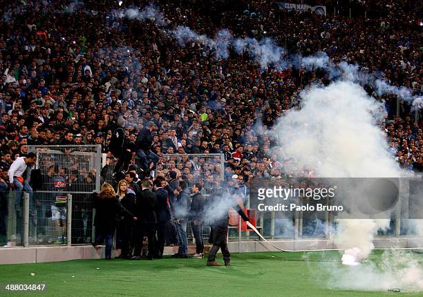 Napoli fans throw a flares before the TIM Cup final match between ACF Fiorentina and SSC Napoli at Olimpico Stadium on May 3, 2014 in Rome, Italy.