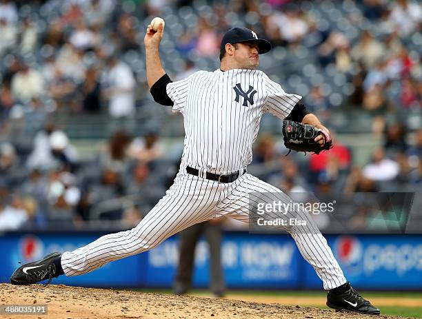 Preston Claiborne of the New York Yankees delivers a pitch in the ninth inning against the Tampa Bay Rays on May 3, 2014 at Yankee Stadium in the...