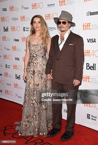 Actress Amber Heard and actor Johnny Depp attend 'The Danish Girl' premiere during the 2015 Toronto International Film Festival at the Princess of...