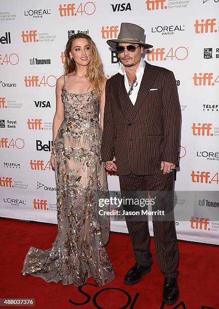 Actress Amber Heard and actor Johnny Depp attend 'The Danish Girl' premiere during the 2015 Toronto International Film Festival at the Princess of...