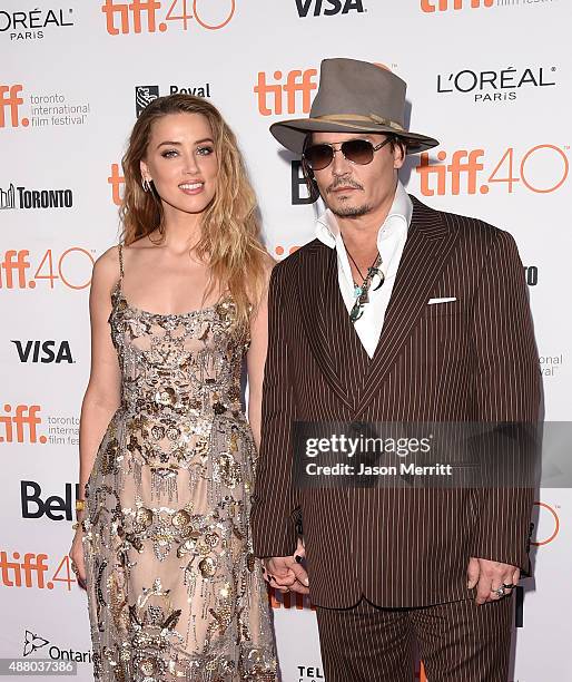 Actress Amber Heard and actor Johnny Depp attend 'The Danish Girl' premiere during the 2015 Toronto International Film Festival at the Princess of...