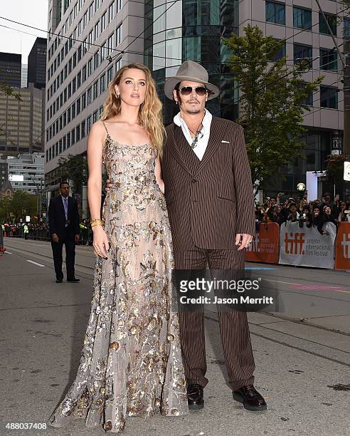 Actress Amber Heard and actor Johnny Depp attend 'The Danish Girl' premiere during the 2015 Toronto International Film Festival at the Princess of...