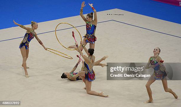 Daria Kleshcheva, Anastasiia Maksimova, Sofya Skomorokh, Anastasiia Tatareva and Maria Tolkacheva of Russia compete in the Group Apparatus Clubs and...