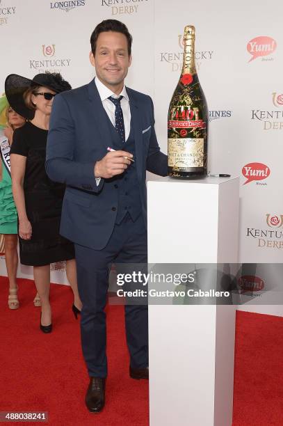 Josh Hopkins toasts with Moet & Chandon at the 140th Kentucky Derby at Churchill Downs on May 3, 2014 in Louisville, Kentucky.