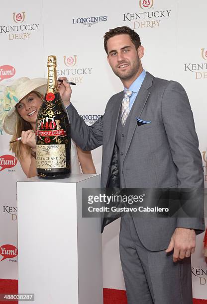 Basketball player Luke Hancock and guest toast with Moet & Chandon at the 140th Kentucky Derby at Churchill Downs on May 3, 2014 in Louisville,...