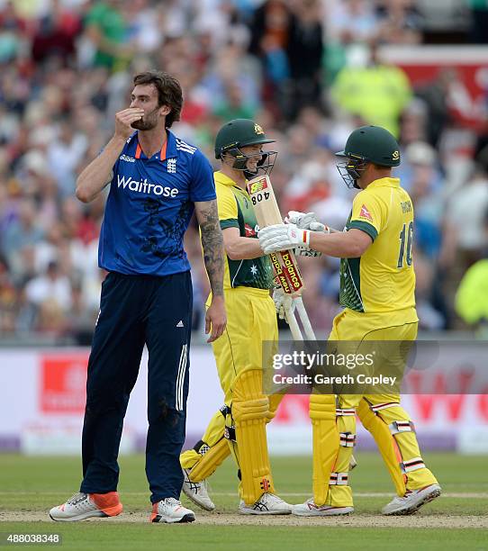 George Bailey and Aaron Finch of Australia celebrate as Reece Topley of England reacts after winning the 5th Royal London One-Day International match...
