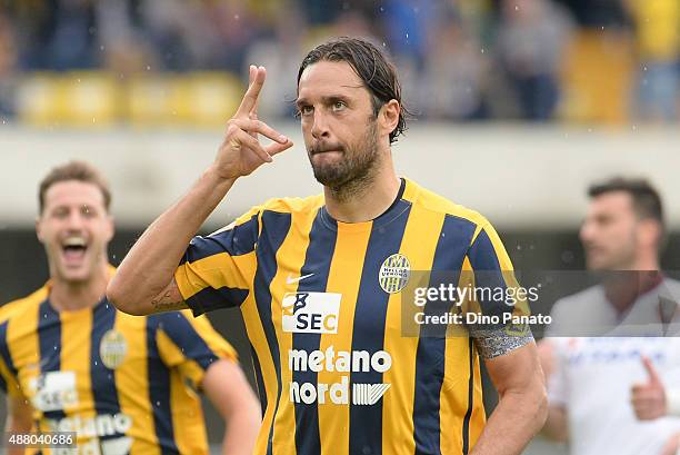 Luca Toni of Helas Verona celebrates after scoring his opening goal from the penalthy spot during the Serie A match between Hellas Verona FC and...