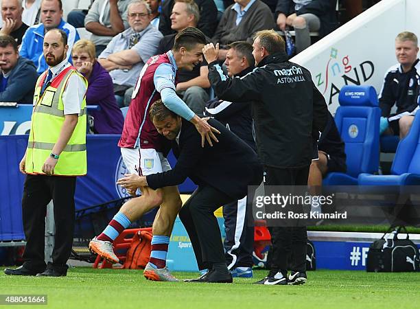 Jack Grealish of Aston Villa celebrates with Tim Sherwood manager of Aston Villa and coach Mark Robson as he scores their first goal during the...