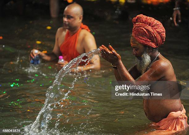 Sadhus of 10 akharas take bath on the auspicious day of Mauni Amavasya during the Maha Kumbh Mela at Trimbakeshwar, on September 13, 2015 in Nashik,...