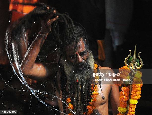 Sadhus of 10 akharas take bath on the auspicious day of Mauni Amavasya during the Maha Kumbh Mela at Trimbakeshwar, on September 13, 2015 in Nashik,...
