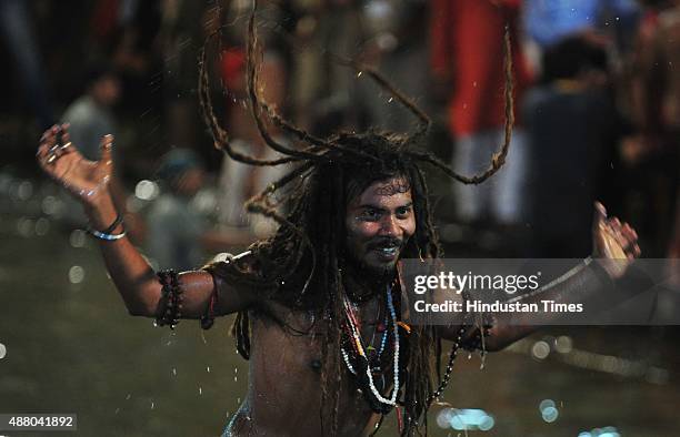 Sadhu of 10 akharas takes bath on the auspicious day of Mauni Amavasya during the Maha Kumbh Mela at Trimbakeshwar, on September 13, 2015 in Nashik,...