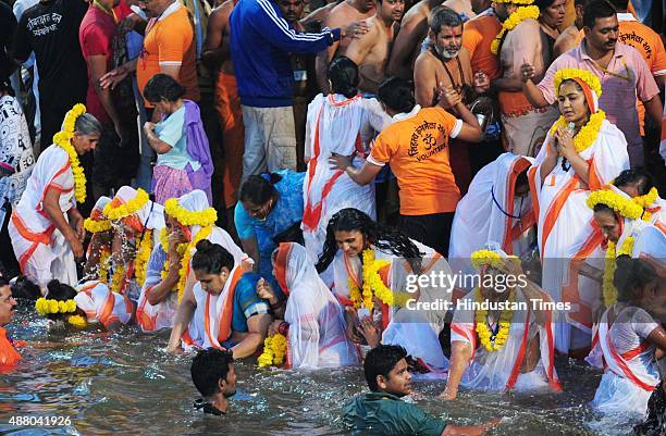 Devotees take bath on the auspicious day of Mauni Amavasya during the Maha Kumbh Mela at Trimbakeshwar, on September 13, 2015 in Nashik, India. The...