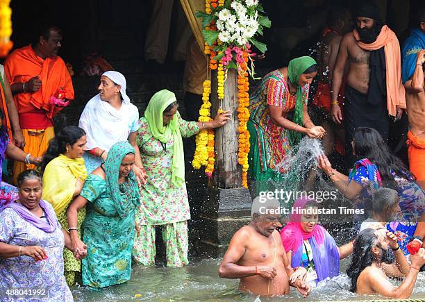Devotees take bath on the auspicious day of Mauni Amavasya during the Maha Kumbh Mela at Trimbakeshwar, on September 13, 2015 in Nashik, India. The...