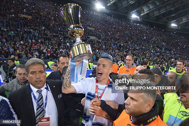 Napoli's Slovakian midfielder Marek Hamsik holds the trophy after winning the Italian Tim Cup football final between Fiorentina and Napoli on May 3,...