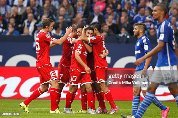 Yunus Malli of Mainz celebrates scoring the 1:1 with Yoshinori Muto of Mainz and teammates during the Bundesliga match between FC Schalke 04 and 1....