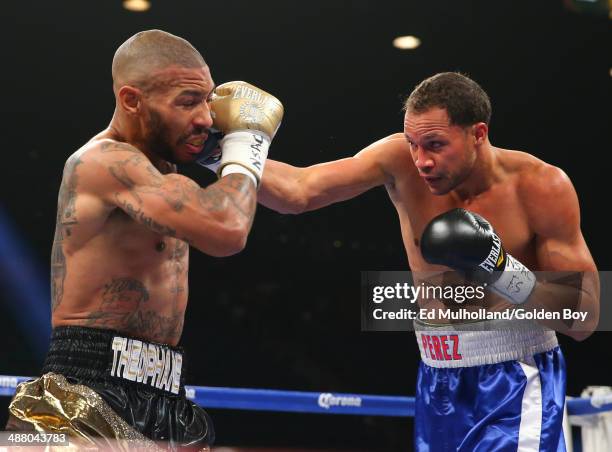 Ashley Theophane takes a right hand to the head from Angino Perez during their welterweight fight at the MGM Grand Garden Arena on May 3, 2014 in Las...