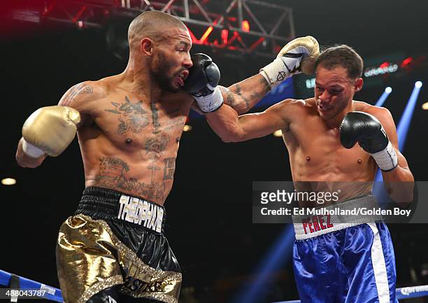 Ashley Theophane and Angino Perez trade punches during their welterweight fight at the MGM Grand Garden Arena on May 3, 2014 in Las Vegas, Nevada.