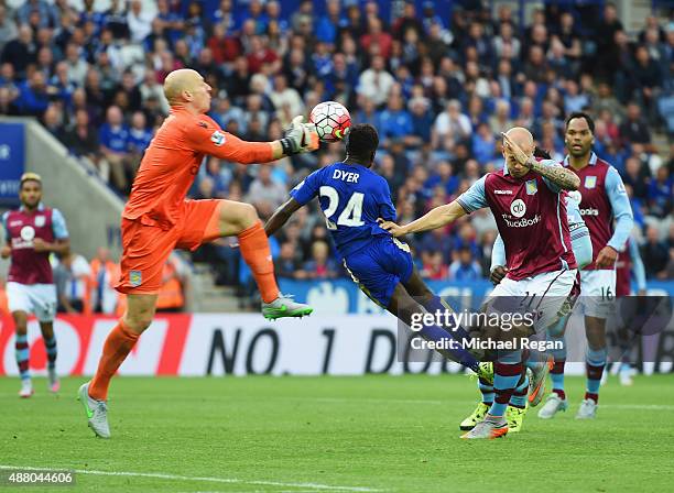 Nathan Dyer of Leicester City beats goalkeeper Brad Guzan of Aston Villa to score their third goal during the Barclays Premier League match between...