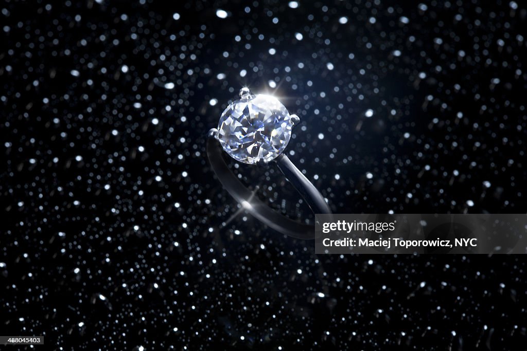 Diamond ring against starry sky