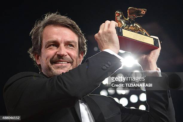 Director Lorenzo Vigas poses with the Golden Lion for Best Film for his movie "Desde Alla" after the awards ceremony on the closing day of the 72nd...