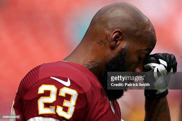 Cornerback DeAngelo Hall of the Washington Redskins looks on prior to the start of a game against the Miami Dolphins at FedExField on September 13,...
