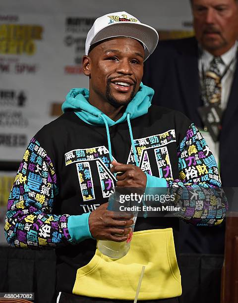 Floyd Mayweather Jr. Smiles during a post-fight news conference at MGM Grand Hotel & Casino after he retained his WBC/WBA welterweight titles in a...