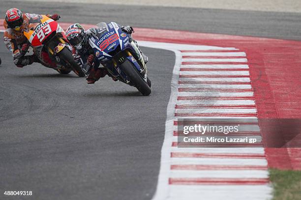 Jorge Lorenzo of Spain and Movistar Yamaha MotoGP leads Marc Marquez of Spain and Repsol Honda Team in the MotoGP World Championship race during the...