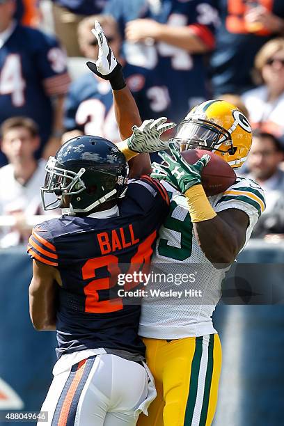James Jones of the Green Bay Packers catches the football for a touchdown in the first quarter against Alan Ball of the Chicago Bears at Soldier...