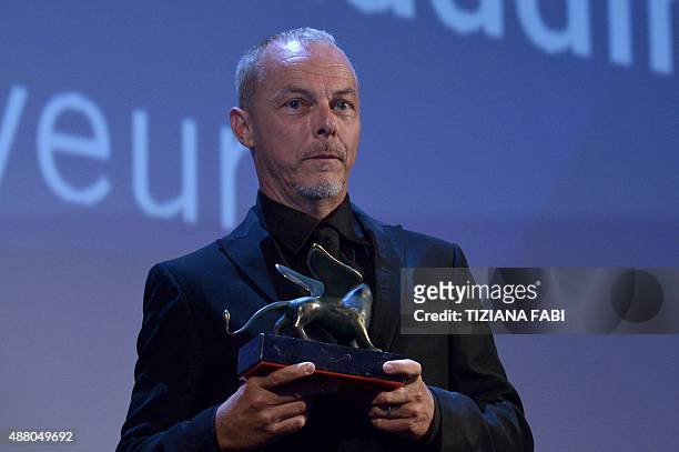 French Yves Montmayeur holds the Venice Classic award for Best Documentary on Cinema for his movie "The 1.000 Eyes of Dr Maddin" during the awards...